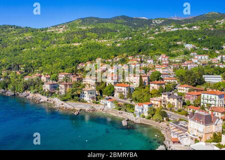 Croatia, beautiful town of Lovran and Lungomare sea walkway, aerial panoramic view in Kvarner bay coastline Stock Photo