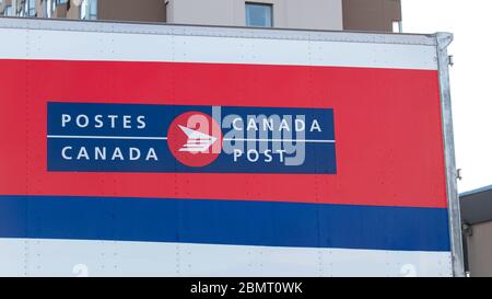 Canada Post logo on the back of transport truck trailer. Stock Photo