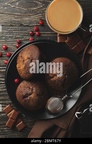 Composition with tasty muffins and cocoa drink on wooden background Stock Photo