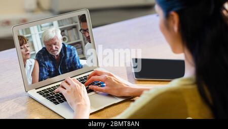 Woman having video call on laptop. Stock Photo