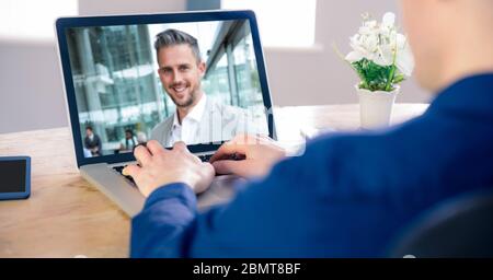 Man having video call on laptop. Stock Photo