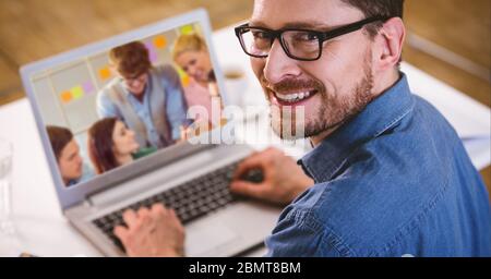 Man working and having a video call on laptop Stock Photo