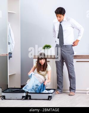 The wife seeing her husband off to business trip Stock Photo