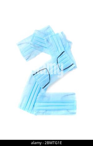 Number two made from protective medical masks on a white background. Stock Photo