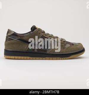 VIENNA, AUSTRIA - JANUARY 12, 2018: Nike SB Zoom Dunk Low Pro olive green camo and black sneaker on white background. Stock Photo