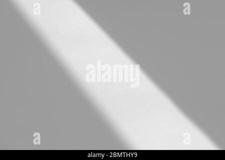 Diagonal rays of light on a gray background. Blurred abstract ...