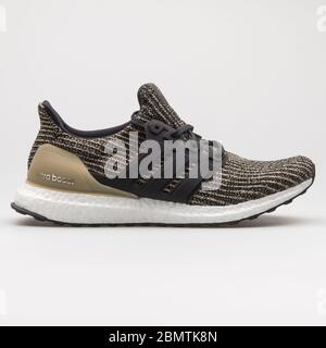 VIENNA, AUSTRIA - FEBRUARY 19, 2018: Adidas Ultra Boost beige and black sneaker on white background. Stock Photo