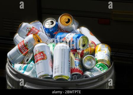 A bin of assorted empty beer cans Stock Photo