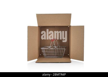 empty shopping basket in cardboard box isolated on white background. crisis and empty shelves concept Stock Photo