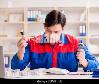 The worker in uniform working on project Stock Photo