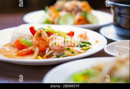 Shrimp salad with vegetables,spice and white boiled rice.Delicious Vietnamese cuisine for lunch.Enjoy natural seafood cooked with traditional recipe f Stock Photo