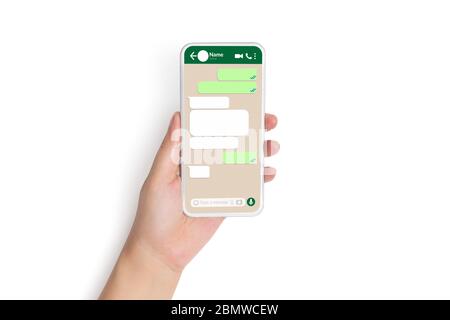 closeup hand holding smart phone with social network mock up blank speech bubbles template chat box dialogue on phone screen for text chatting Stock Photo