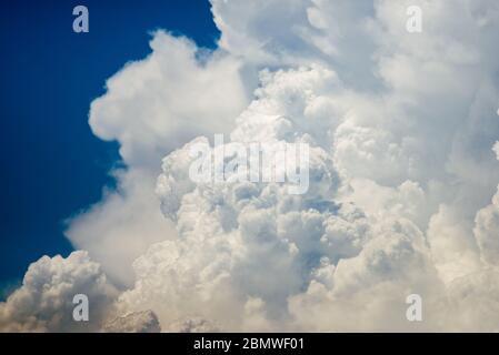 Cumulus humilis clouds in the blue sky, view from below Stock Photo