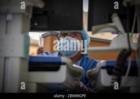 NEWARK, USA - 07 May 2020 - Armela Manas, a registered nurse, uses a computer on wheels at University Hospital in Newark, N.J., May 7, 2020. “I don’t Stock Photo