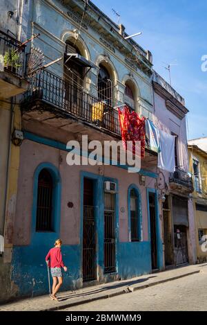 Woman with a walking stick in the Old City Centre, Havana Vieja, Havana, Cuba Stock Photo