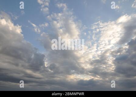Blue cloudy sky on a summer evening. Stock Photo