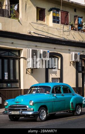 Vintage car driving in Havana Centro district, Havana, Cuba Stock Photo