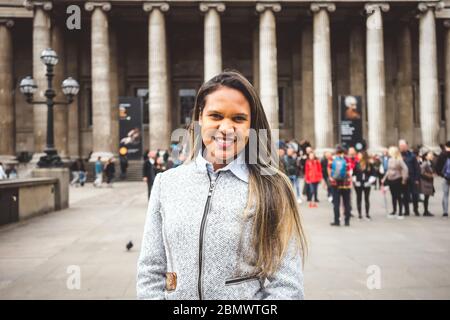 Pretty girl standing in front of famous British Museum in London, Great Britain Stock Photo