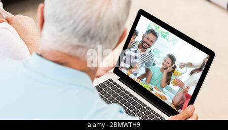 Senior man having video call on laptop. Stock Photo