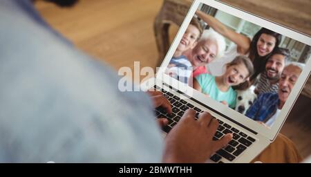 Family having video call on laptop Stock Photo