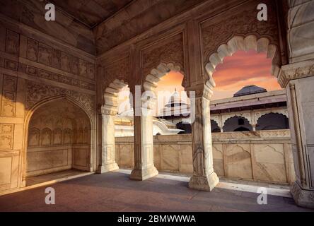 Khas Mahal palace from marble with beautiful arches in Agra Fort at orange sunset sky. Architecture of India. Stock Photo