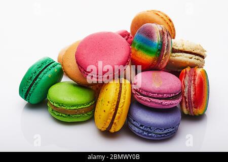 Multi-colored Macaron folded in a stack on a white background Stock Photo