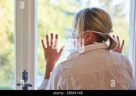 Senior woman at home in lockdown quarantine as a coronavirus pandemic at risk Stock Photo
