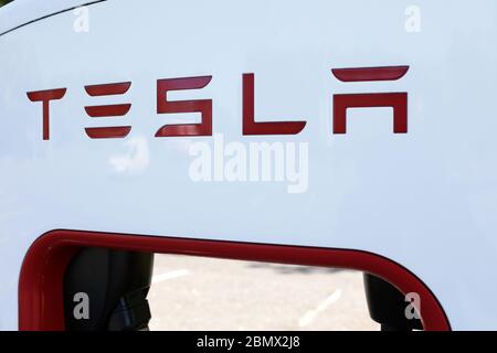 Tesla Electronic Vehicle charging point at a service station along the M62, Yorkshire, UK. Stock Photo
