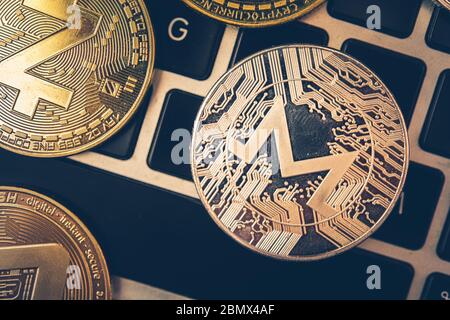 Close Up Of Crypto Currency Golden Coins On Top Of Computer Keyboard. Stock Photo