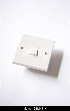 Isolated light switch against a white background. Useful for cut outs. Stock Photo
