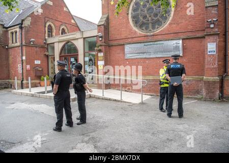 Police attend Didsbury Mosque once frequented by the Manchester suicide bomber Salman Abedi.  The Didsbury Mosque, and the Manchester Islamic Centre are co-located on Burton Road, West Didsbury, in Manchester, England. The building was originally the 'Albert Park Methodist Chapel', which opened for worship in 1883 but in 1962 the chapel closed and was later converted into a mosque. It has an attendance of around 1,000 people.  22 people were killed and 120 injured after a bomb exploded in the foyer of the Manchester Arena venue, between the arena and Victoria Station, on Monday 22 May 2017.  H Stock Photo