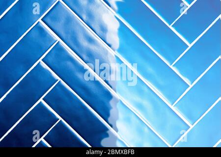 Blue Tiles, dark blue tiles overflowing to light blue background texture retro design Stock Photo