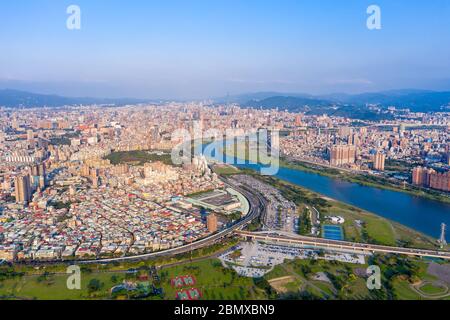 Taipei City Aerial View - Asia business concept image, panoramic modern cityscape building bird’s eye view under daytime and blue sky, shot in Taipei, Stock Photo