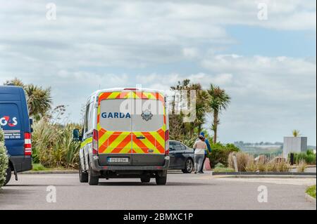 Inchydoney, West Cork, Ireland. 11th May, 2020. A Garda van patrols the beach at Inchydoney in West Cork on a day of sunshine and high winds. Credit: AG News/Alamy Live News Stock Photo