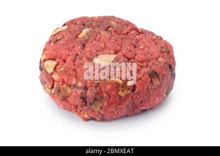 Studio shot of uncooked beef burger cut out against a white background - John Gollop Stock Photo