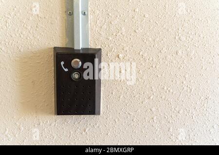 intercom. panel on the wall for calling the emergency service Stock Photo
