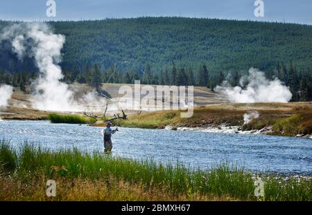 Fly fishing on the firehole river Stock Photo