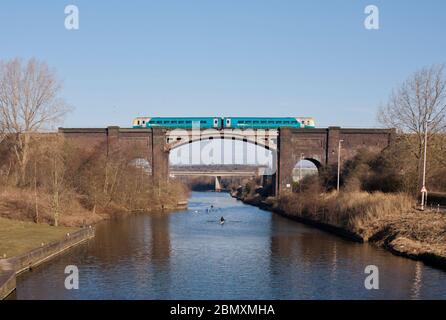 Arriva trains Wales Alstom class 175 Coradia train crossing the weaver navigation viaduct at Frodsham on the north Cheshire line Stock Photo