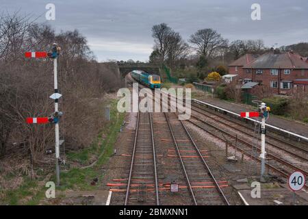 Arriva trains Wales Alstom class 175 Coradia train 175112 at Helsby with upper quadrant mechanical railway signals -  north Cheshire railway line Stock Photo