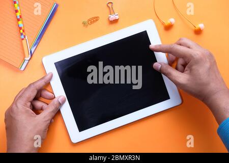Top view of person holding digital tablet with empty screen  Stock Photo