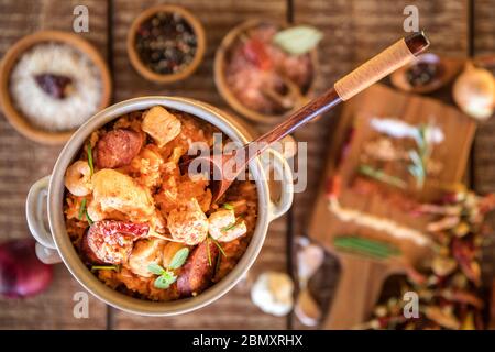 Traditional jambalaya serwed on plate. Top view. Chicken and rice dish with sausage and shrimp. Spice food. Stock Photo