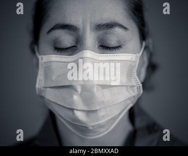 Stop the spread and Save lives campaign. Doctor wearing protection face mask. Protect yourself and others medical advice, basic protective measures ag Stock Photo