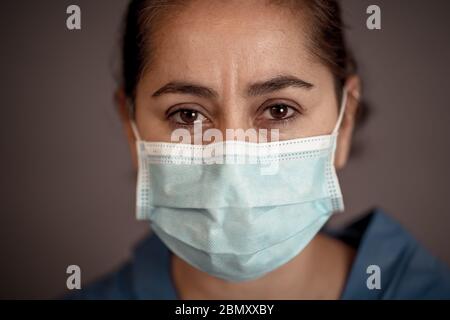 Stop the spread and Save lives campaign. Doctor wearing protection face mask. Protect yourself and others medical advice, basic protective measures ag Stock Photo