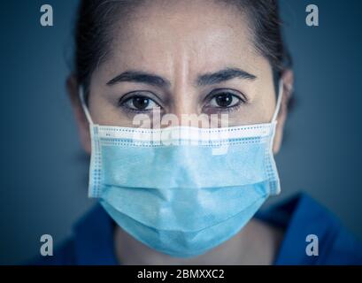 Stop the spread and Save lives campaign. Doctor wearing protection face mask. Protect yourself and others medical advice, basic protective measures ag Stock Photo
