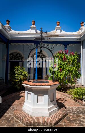 Well in the atrium, Museo de Ambiente Histórico Cubano, 19th century extension, Santiago de Cuba, Cuba Stock Photo