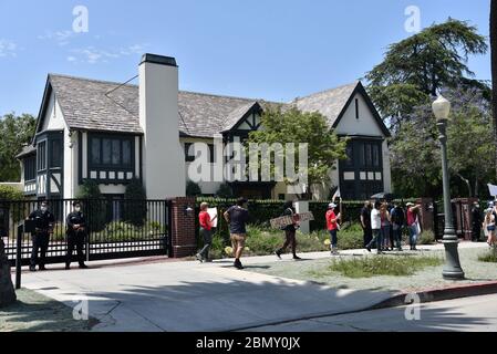 Los Angeles, CA/USA - May 8 2020: Coronavirus quarantine p;rotesters march in front of LA Mayor Eric Garcetti’s home Stock Photo