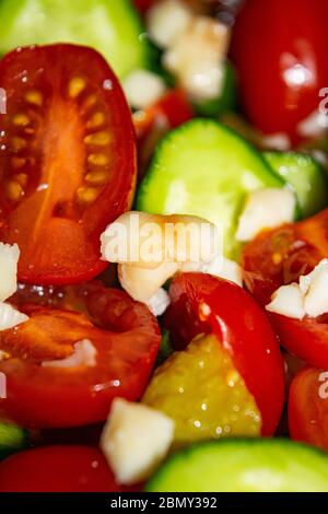 Vegetable salad sliced tomatoes, cucumbers, onions and pickles. Close up. Healthy food, fitness diet Stock Photo