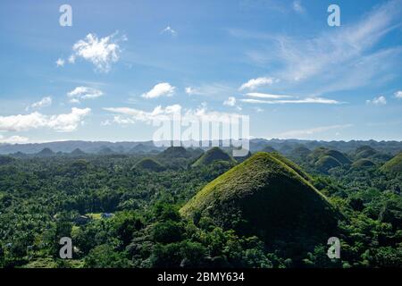 Beautiful view of the chocolate hills in Bohol on a sunny morning. This landscape is a famous tourist attraction in the Philippines Stock Photo