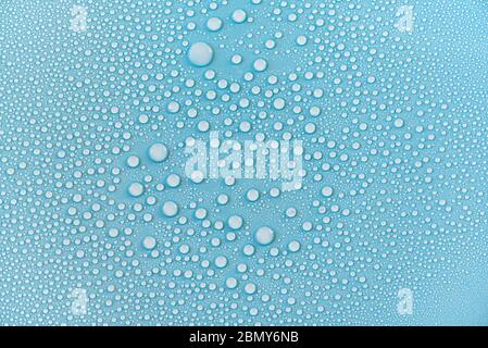 Close-up drops of water on blue surface, raindrops, background or texture Stock Photo