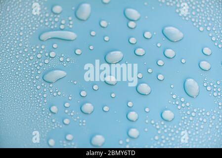 Close-up drops of water on blue surface, raindrops, background or texture Stock Photo